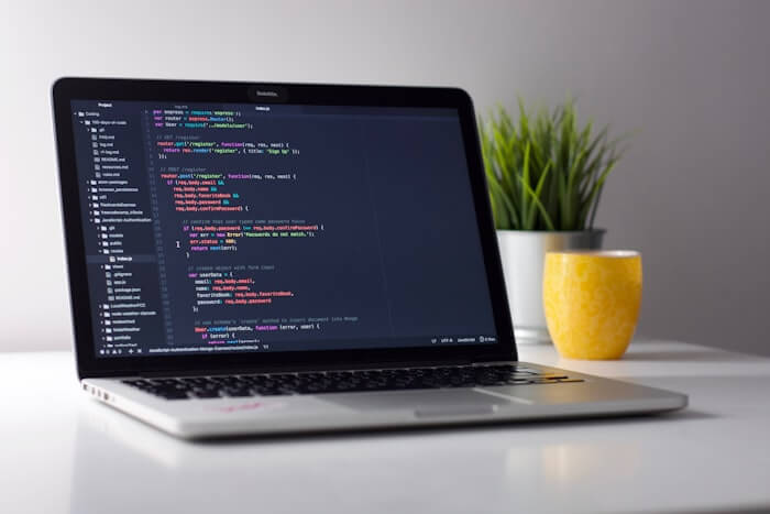 Laptop with code editor in a focused work setting